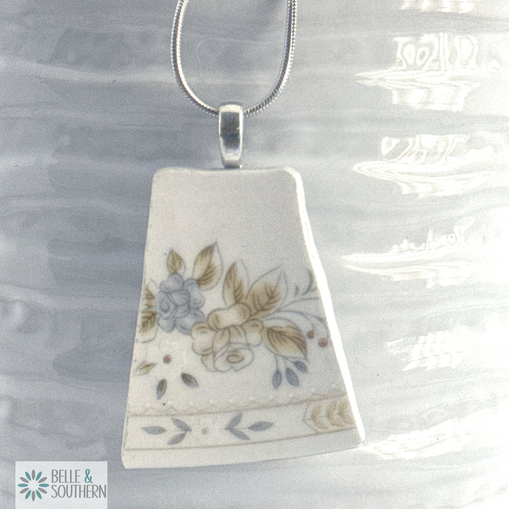 Rectangular pendant with floral design on a white vase featuring the brand 'Belle & Southern'.