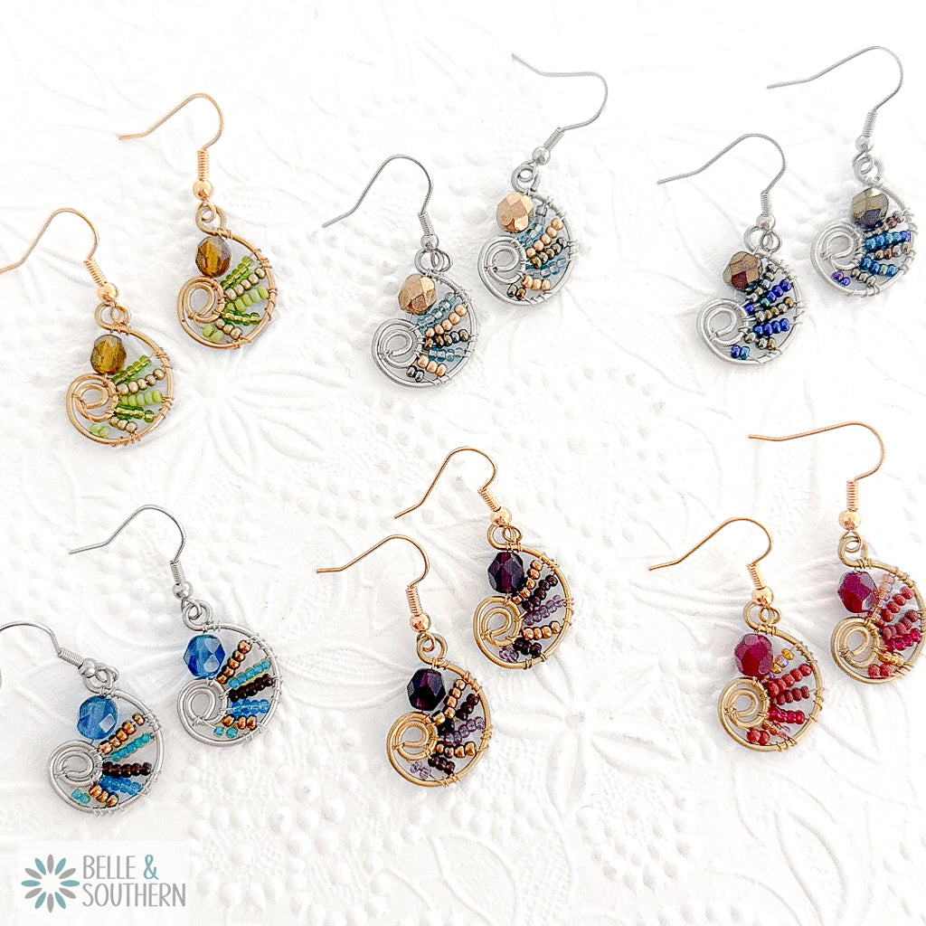 Collection of colorful petite wire paisley and crystal earrings on a white background with 'Belle & Southern' branding.