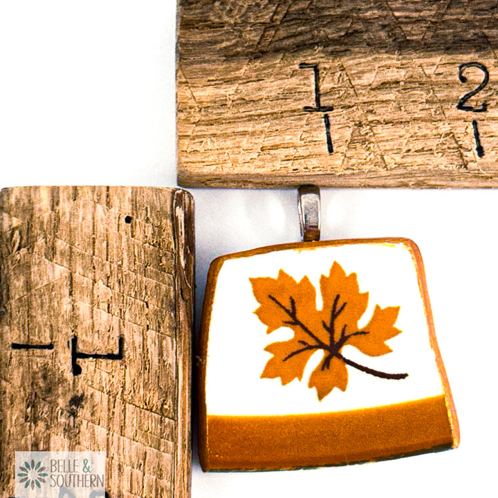Pendant with leaf design by wooden rulers featuring the brand 'Belle & Southern'.