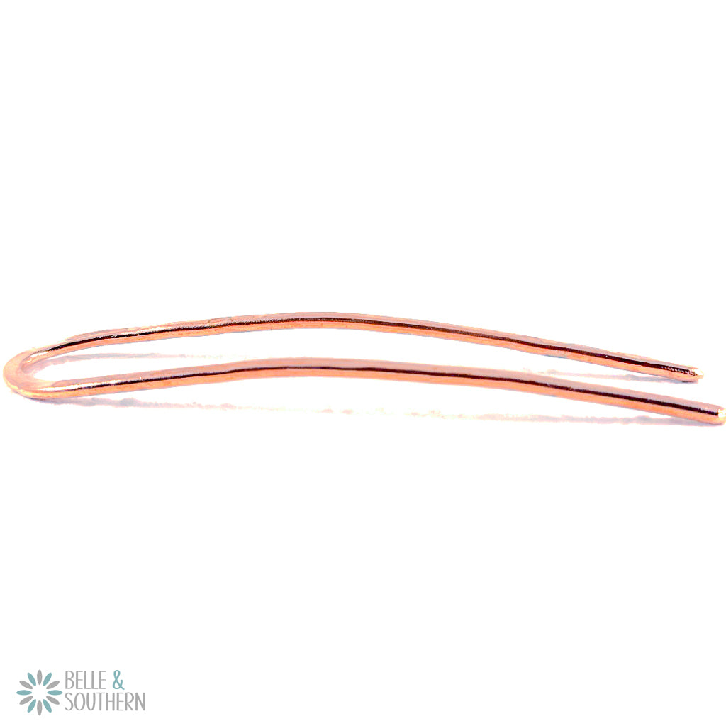 Copper French Pin showing the curve on white background
