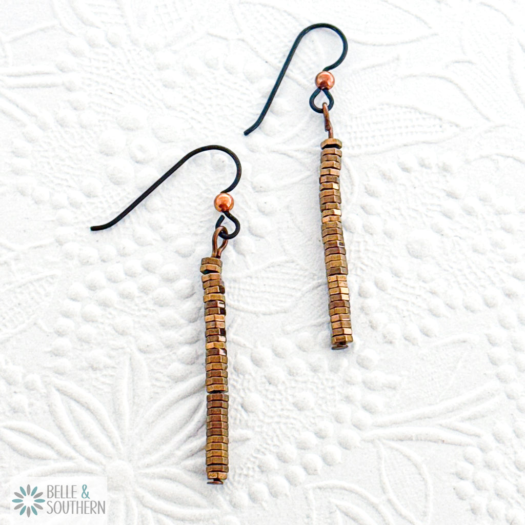 Pair of Copper Hematite Stack Dangle Earring on Niobium Ear Wire on white texture background featuring 'Belle and Southern' brand
