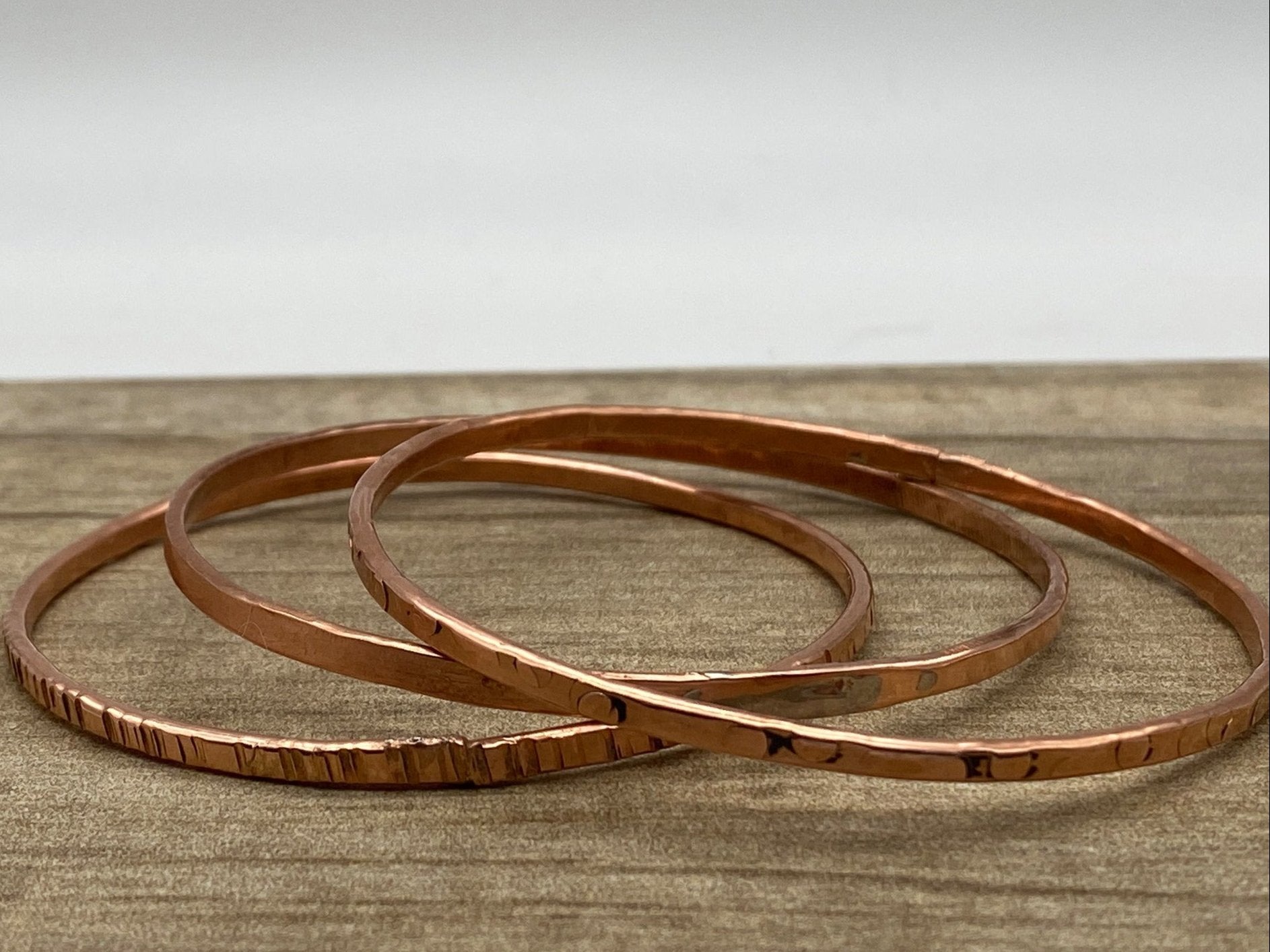 Choice of 2 copper outlet steel bangles.