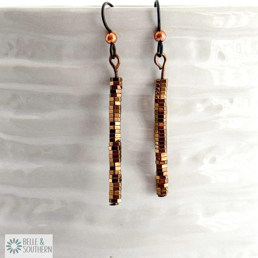 Copper Stacked Hematite Earrings on white vase featuring 'Belle and Southern' brand