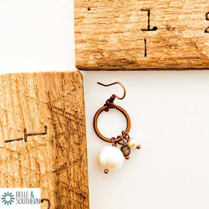 Copper and Pearl Earrings Small Hoop next to ruler