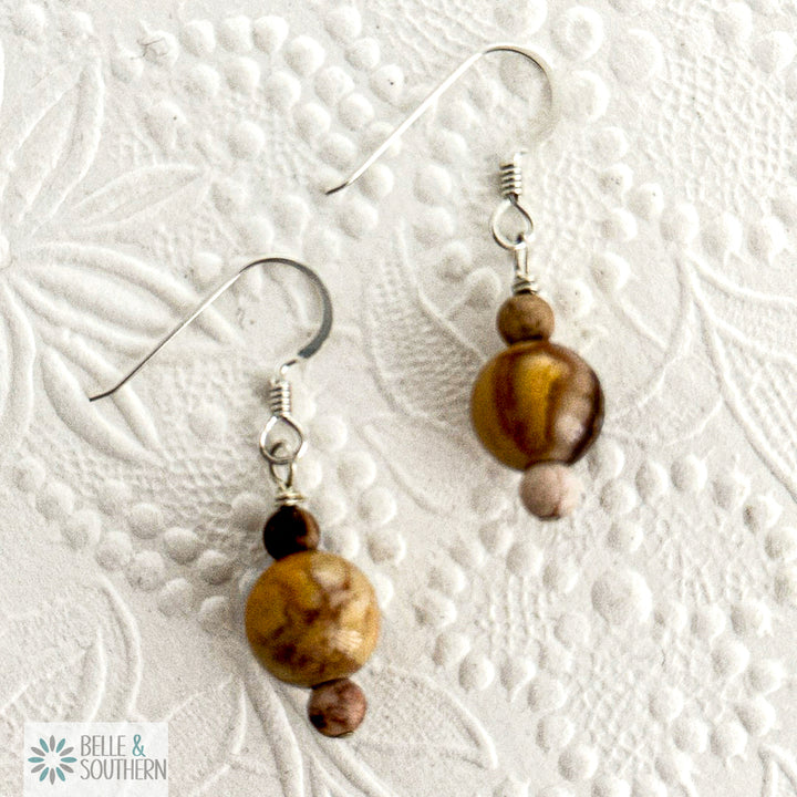 Drop earrings with warm-toned Zebra Jasper beads in earthy browns and creams on Argentium silver ear wires.