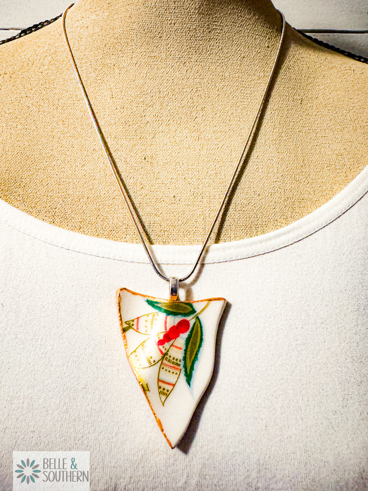 Necklace with a decorative pendant on a mannequin bust, featuring the brand 'Belle & Southern'.
