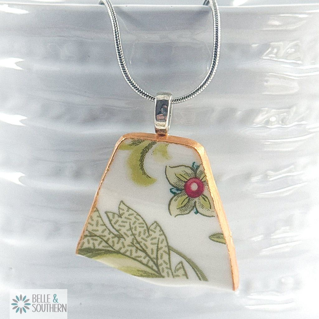 Necklace with a floral pendant on a white background, featuring the brand 'Belle & Southern'.