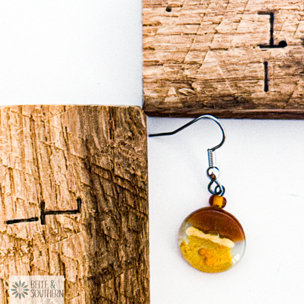 Amber and Gold Fused Glass Earrings next to wooden ruler featuring the Belle and Southern Brand
