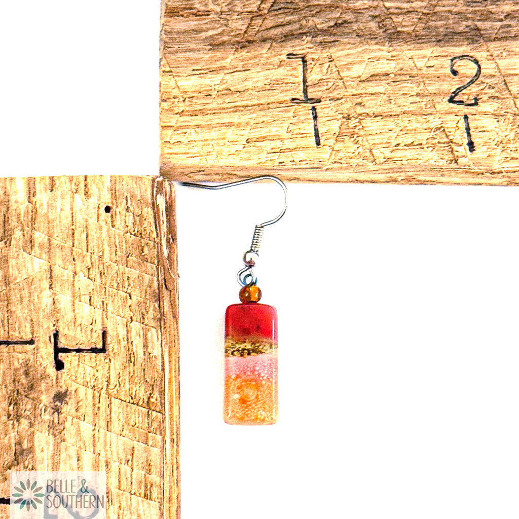 Small Rectangle Coral, Pink and Gold Fused Glass Earrings next to measuring ruler featuring Belle and Southern Brand