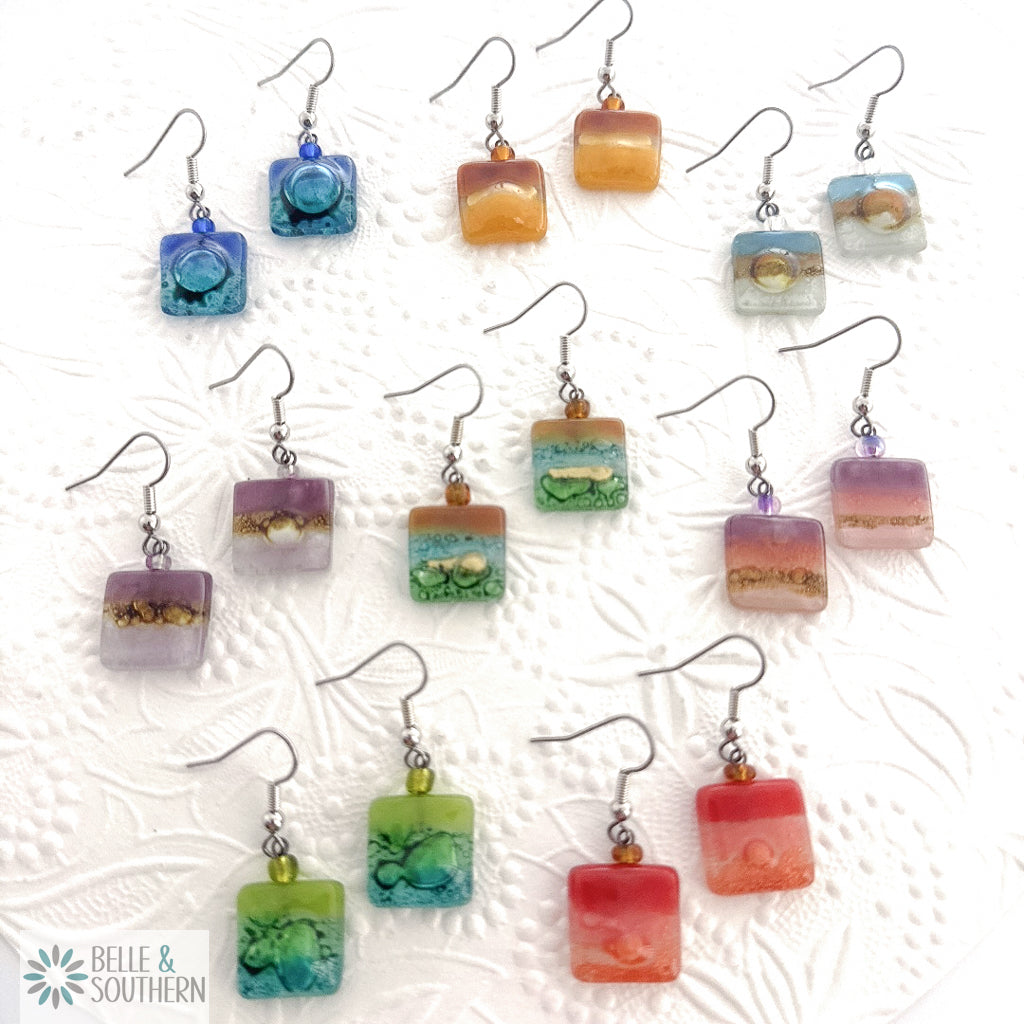 Colorful square-shaped earrings on a textured white background with 'Belle & Southern' branding.