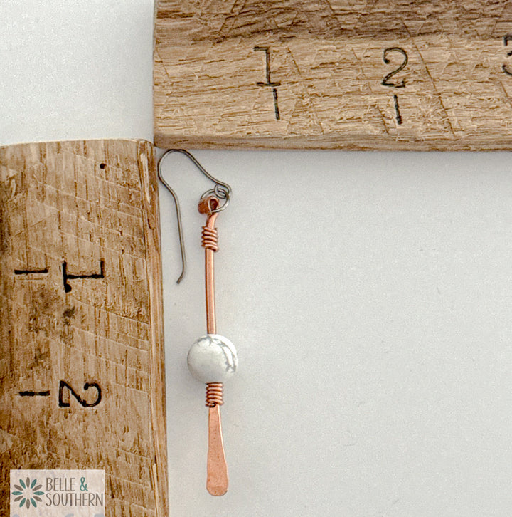 Copper Dangle Earring with Howlite Gemstone next to ruler for measurement
