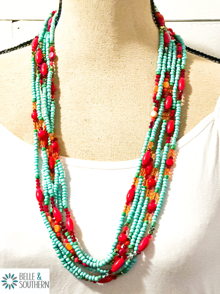Multicolor glass bead necklace set shown layered on mannequin bust