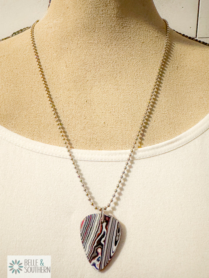 Necklace with a colorful pendant on a mannequin bust, featuring the brand 'Belle & Southern'.