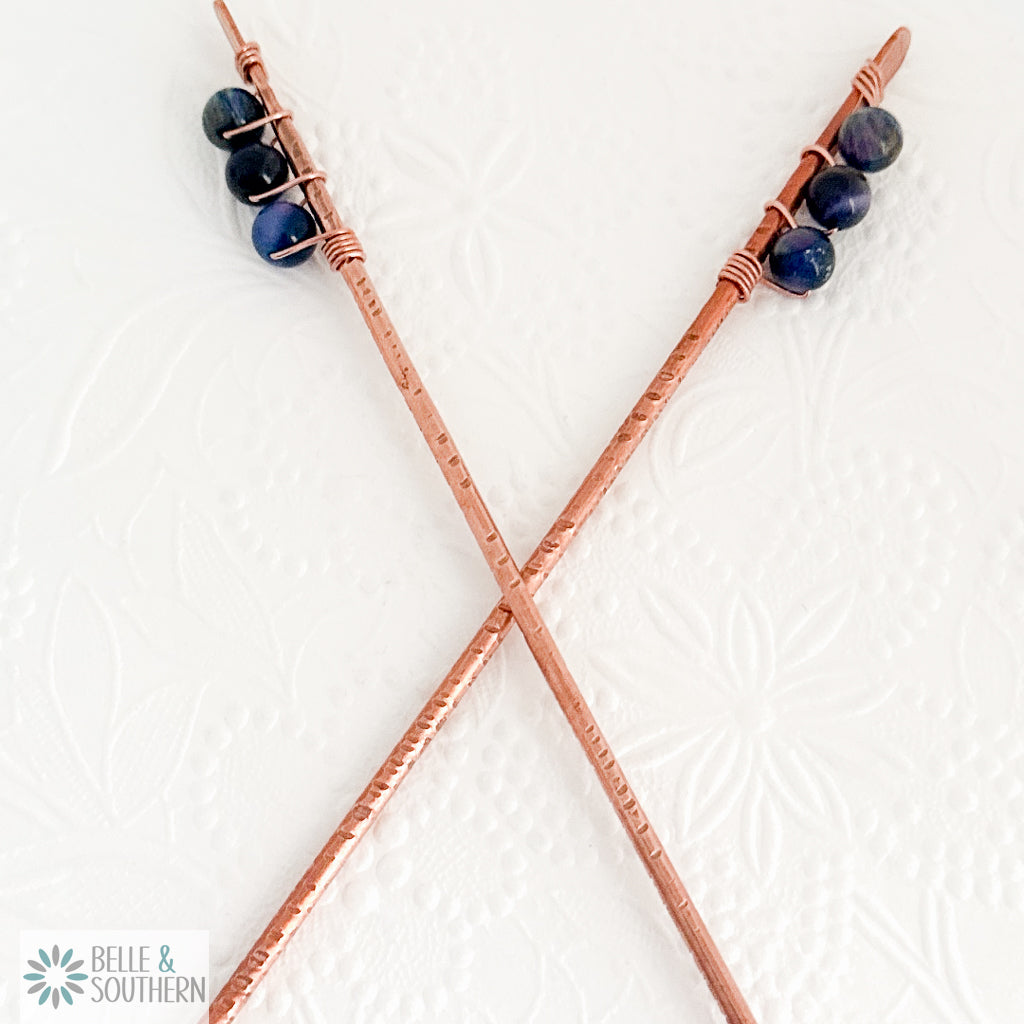 Pair of Rainbow Tigers Eye Stone Bead on pair of copper hair sticks
