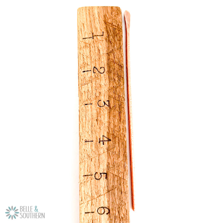 Petite Textured Copper Hair Stick by ruler for measurement
