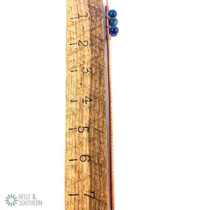 Rainbow Tiger's Eye Hair Stick next to Ruler to reflect 7.5 in length
