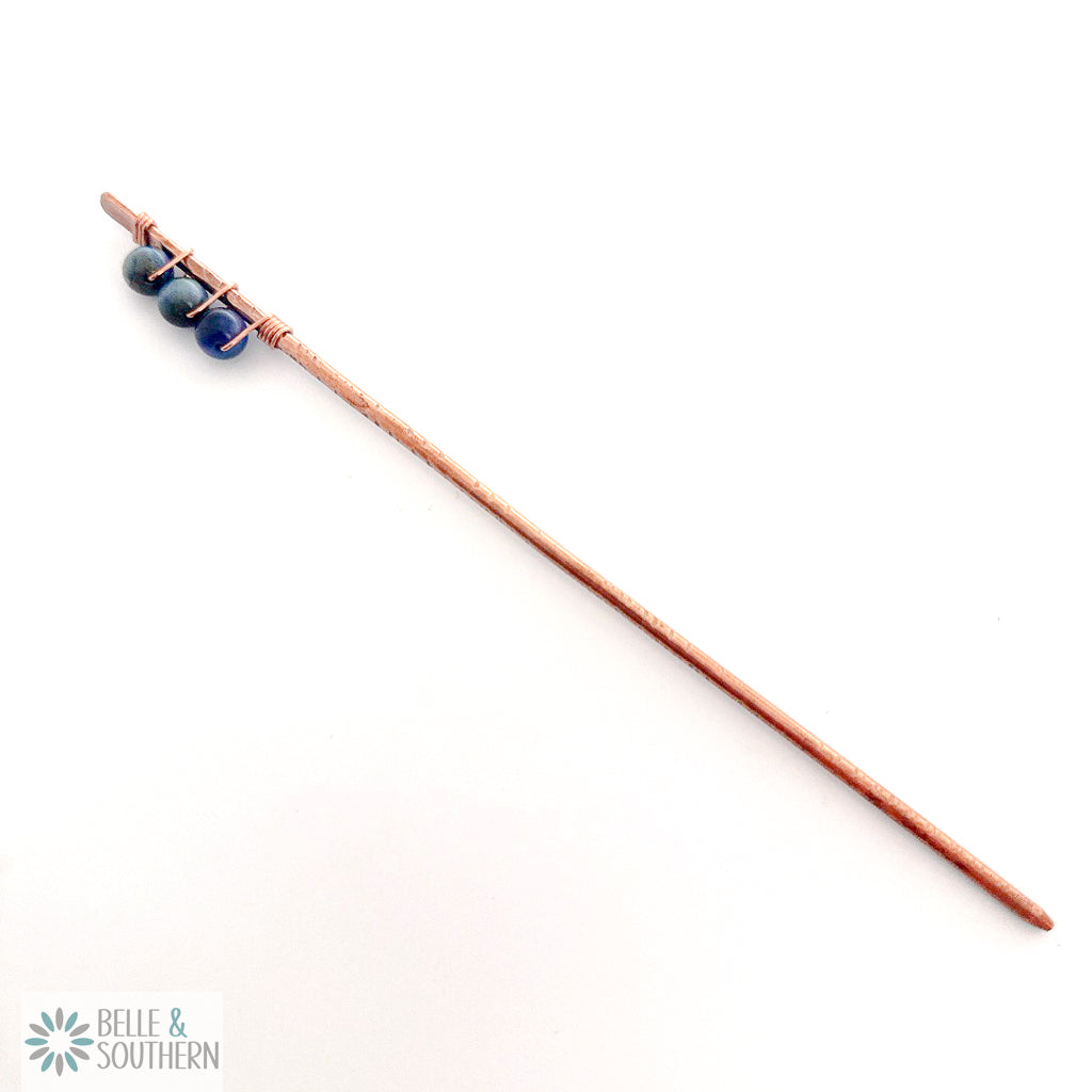 3 Rainbow Tiger's Eye Gemstone Beads wrapped around a textured copper hair stick