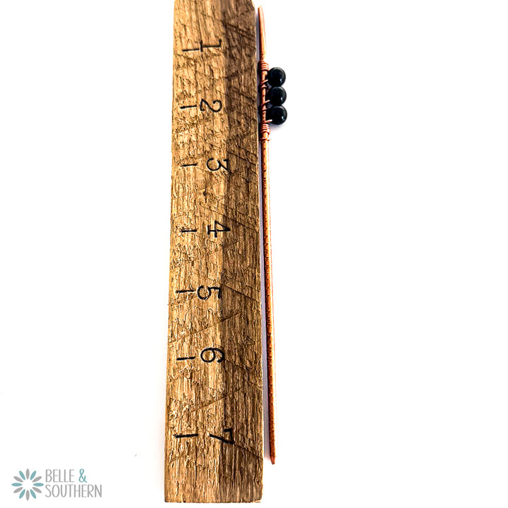 Sparkling Green Goldstone Copper Hair Stick next to a ruler