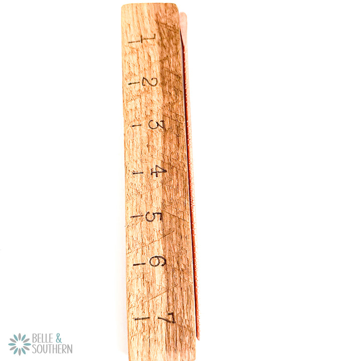 Textured Copper Hair Stick next to ruler to provide approx 7.5 in measurement
