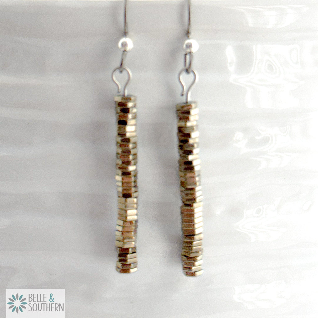 Titanium Hematite Stone Earrings on white vase featuring 'Belle and Southern' brand
