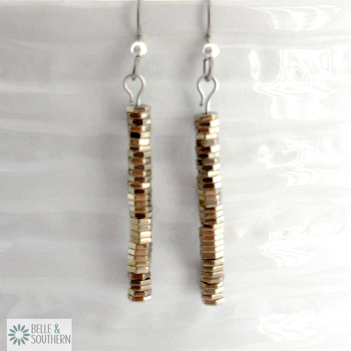 Titanium Hematite Stone Earrings on white vase featuring 'Belle and Southern' brand
