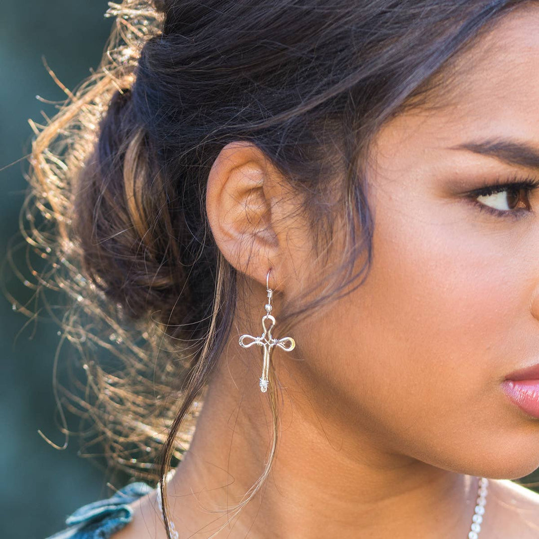 Silver Plated Wire Wrapped Cross Earrings on model